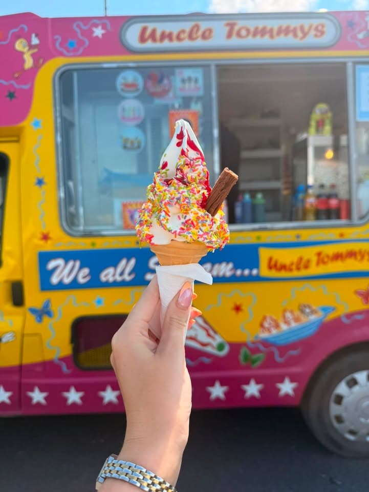 Soft serve ice cream cones in front of the Uncle Tommy's van