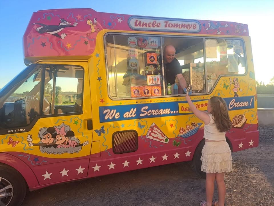 Serving ice cream to a guest at an event